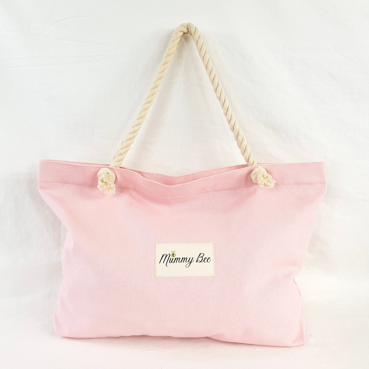 Adult tote bag in pink , has ship rope handles