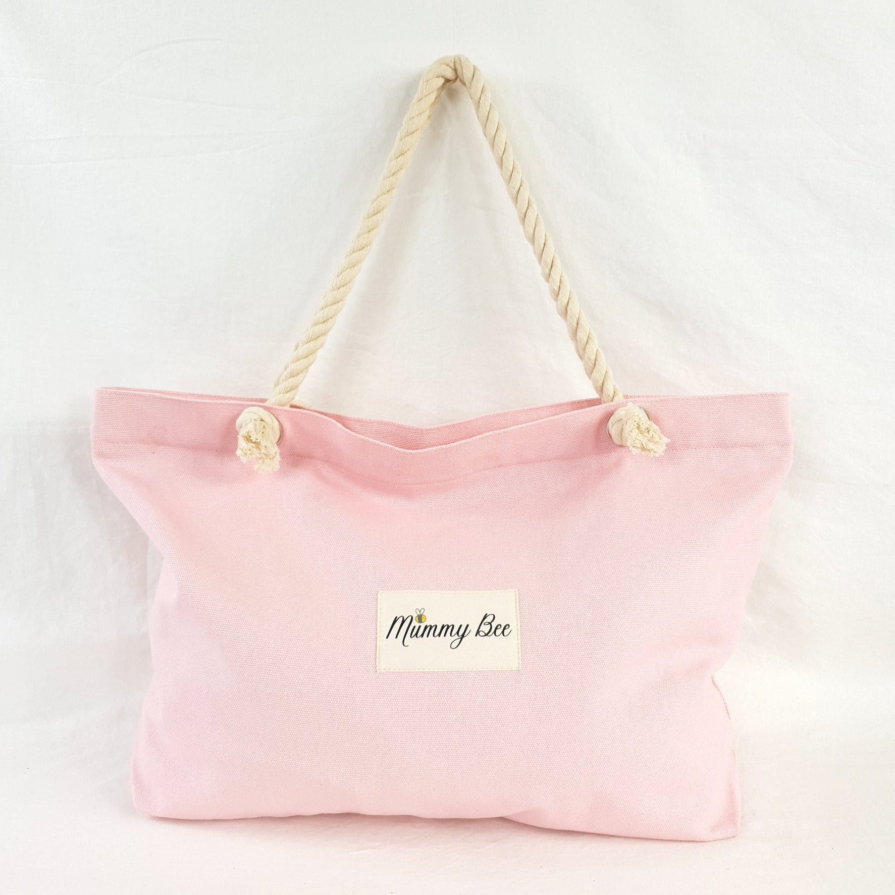 Adult tote bag in pink , has ship rope handles