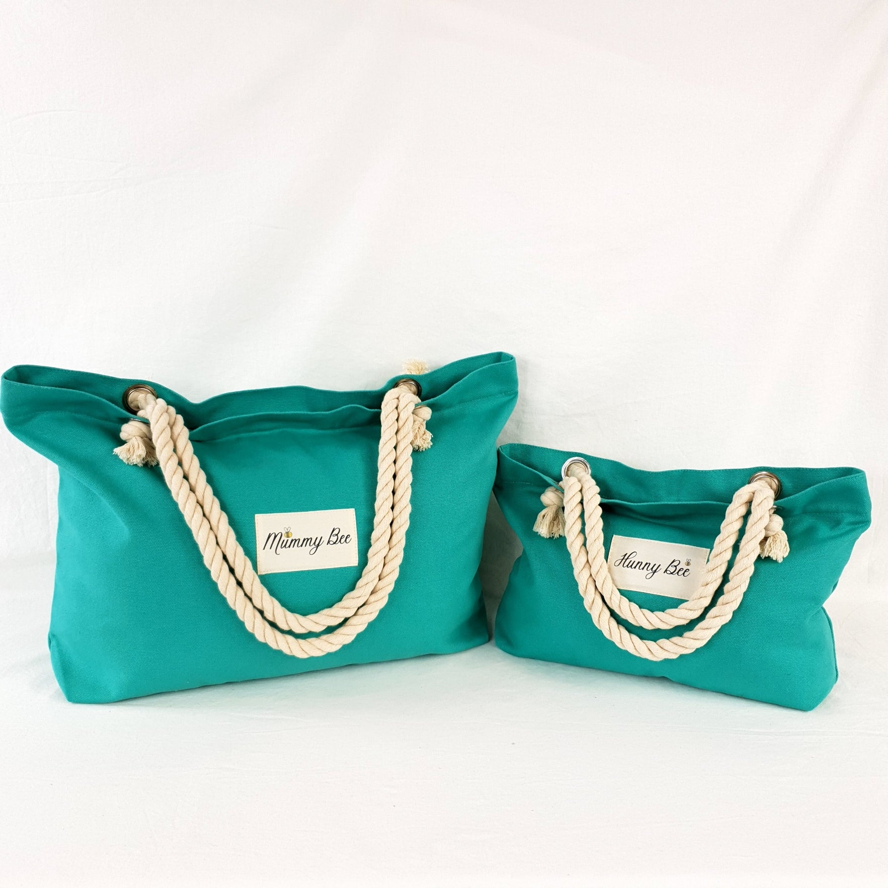 Adult and Child matching tote bag in Teal , has ship rope handles , Adult bag has Mummy bee print and child bag has Hunny Bee print