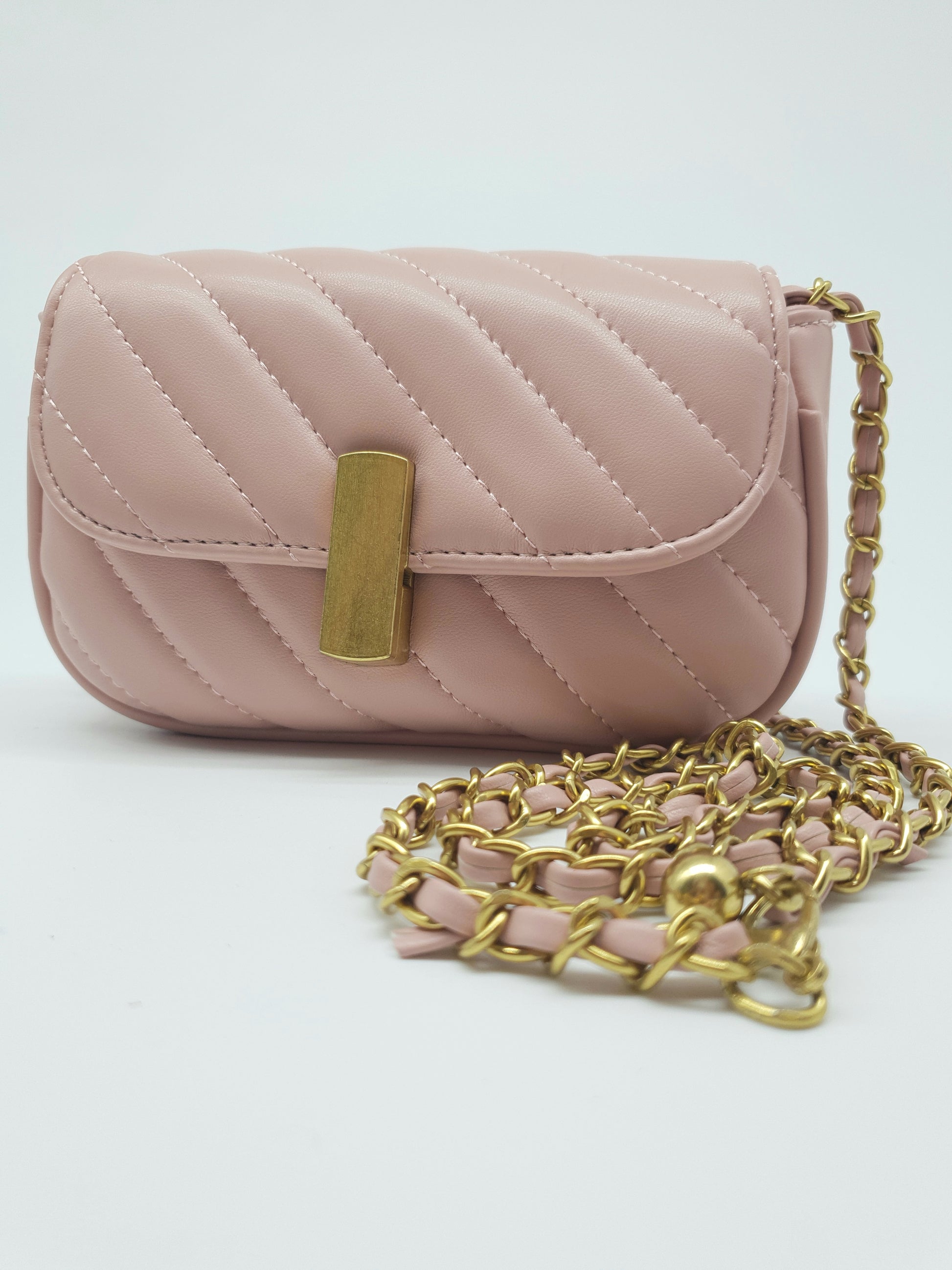 larger pink bag , gold buckle and shoulder straps. Mother Daughter bag 